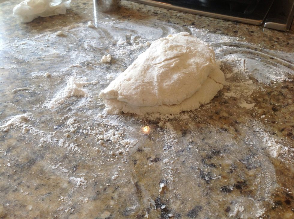 Fold that puppy over one more time- see, you're getting the hang of this! And then carefully flatten it out so you can start cutting out some biscuits.