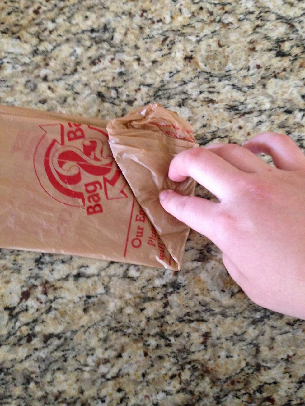 Fold that triangle up to make another triangle.