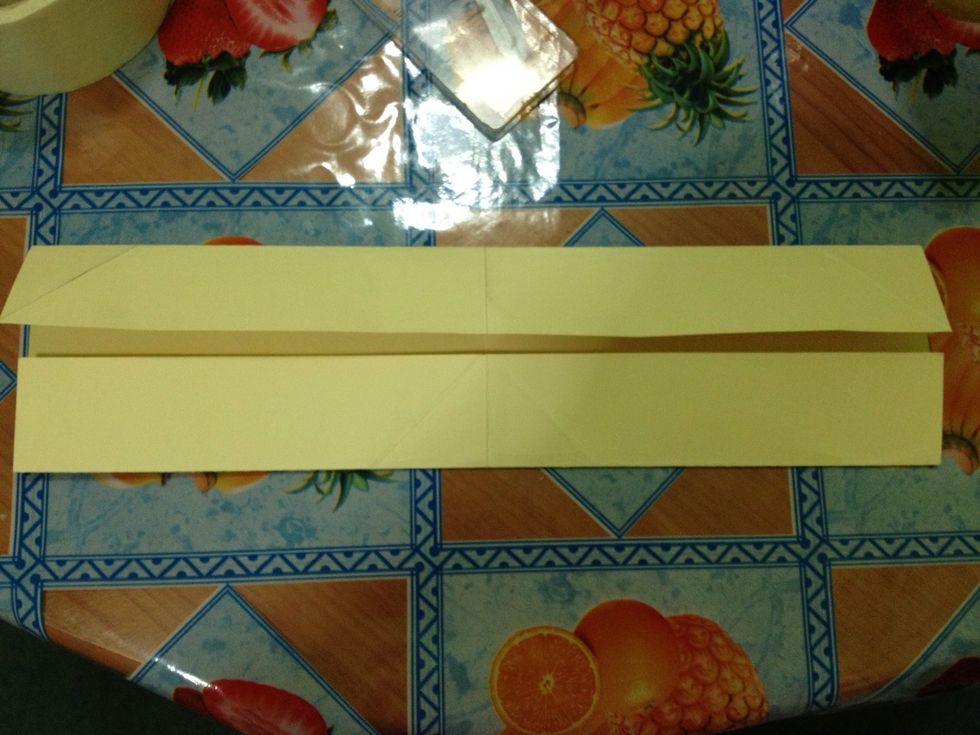 Fold that \ud83d\udc46part of the paper to the middle crease.