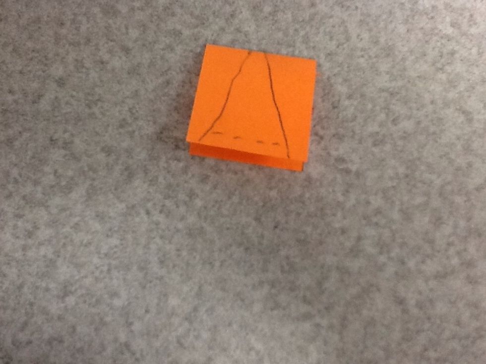 Fold the beak part in half and draw a beak on it as shown