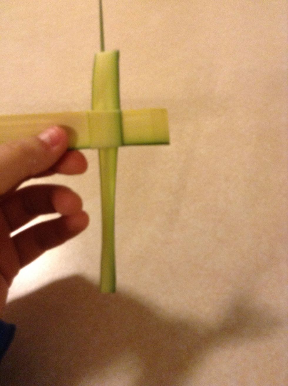 Fold the big end back to the left and under the little flap.