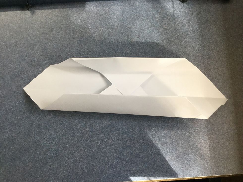 Fold the bits you just folded up as shown.