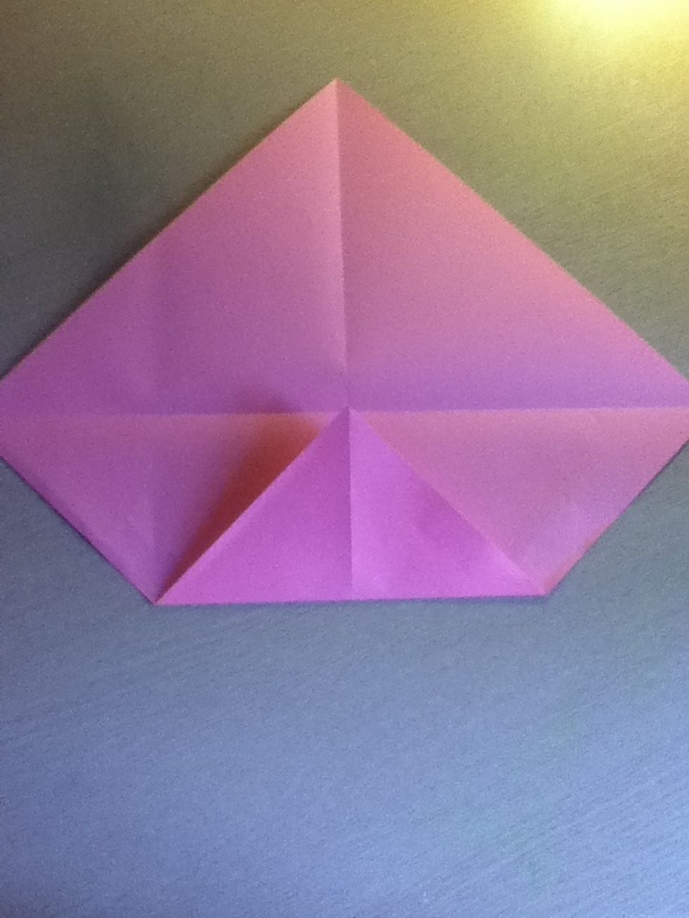 Fold the bottom corner to the middle