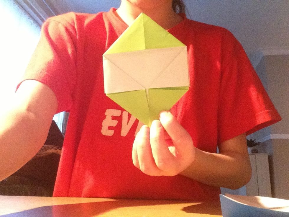 Fold the bottom corners into the middle to make a diamond with flat edges