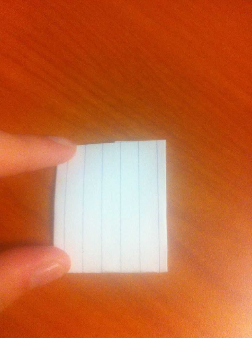 Fold the bottom edge of the card up to the tip of the card and make a crease. Essentially fold the card in half by bringing the bottom part up to meet the top.