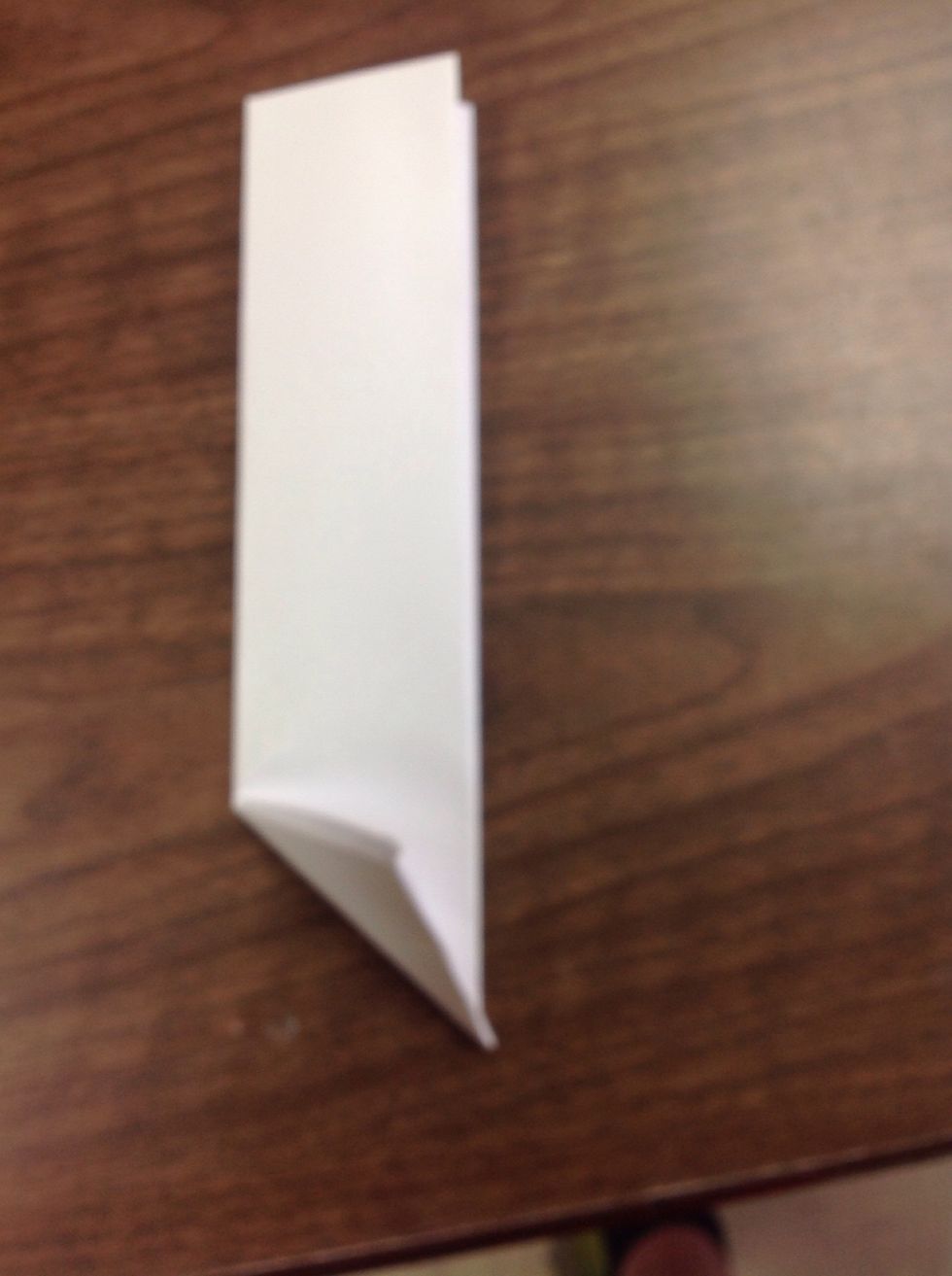 Fold the bottom into a triangle again