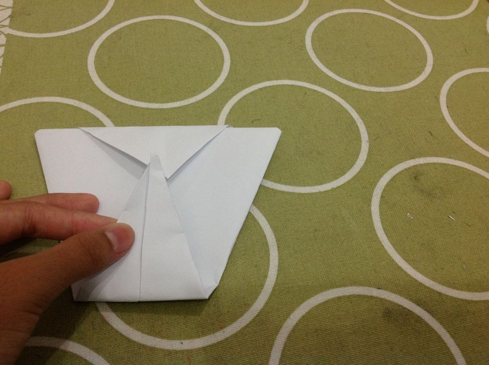 Fold the bottom part up, where it meets the top triangle.