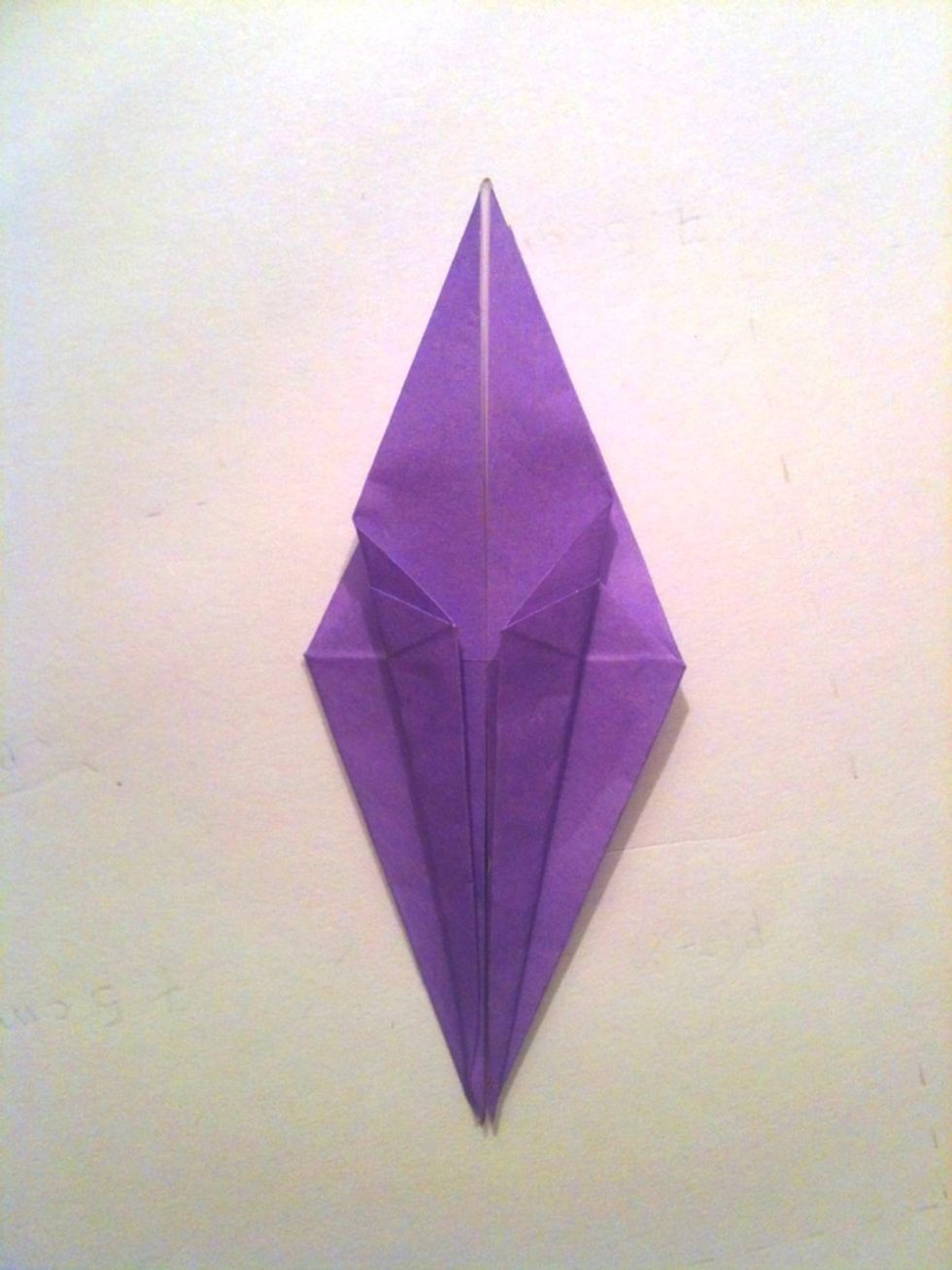 Fold the bottom sides towards the center line,  again making sure that they are aligned with it.