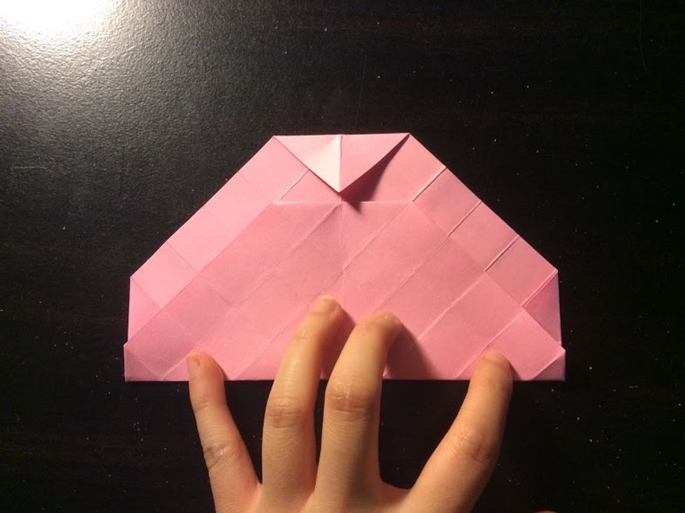 Fold the bottom to the point of the flap. Unfold and rotate it, repeating the steps 3 times.