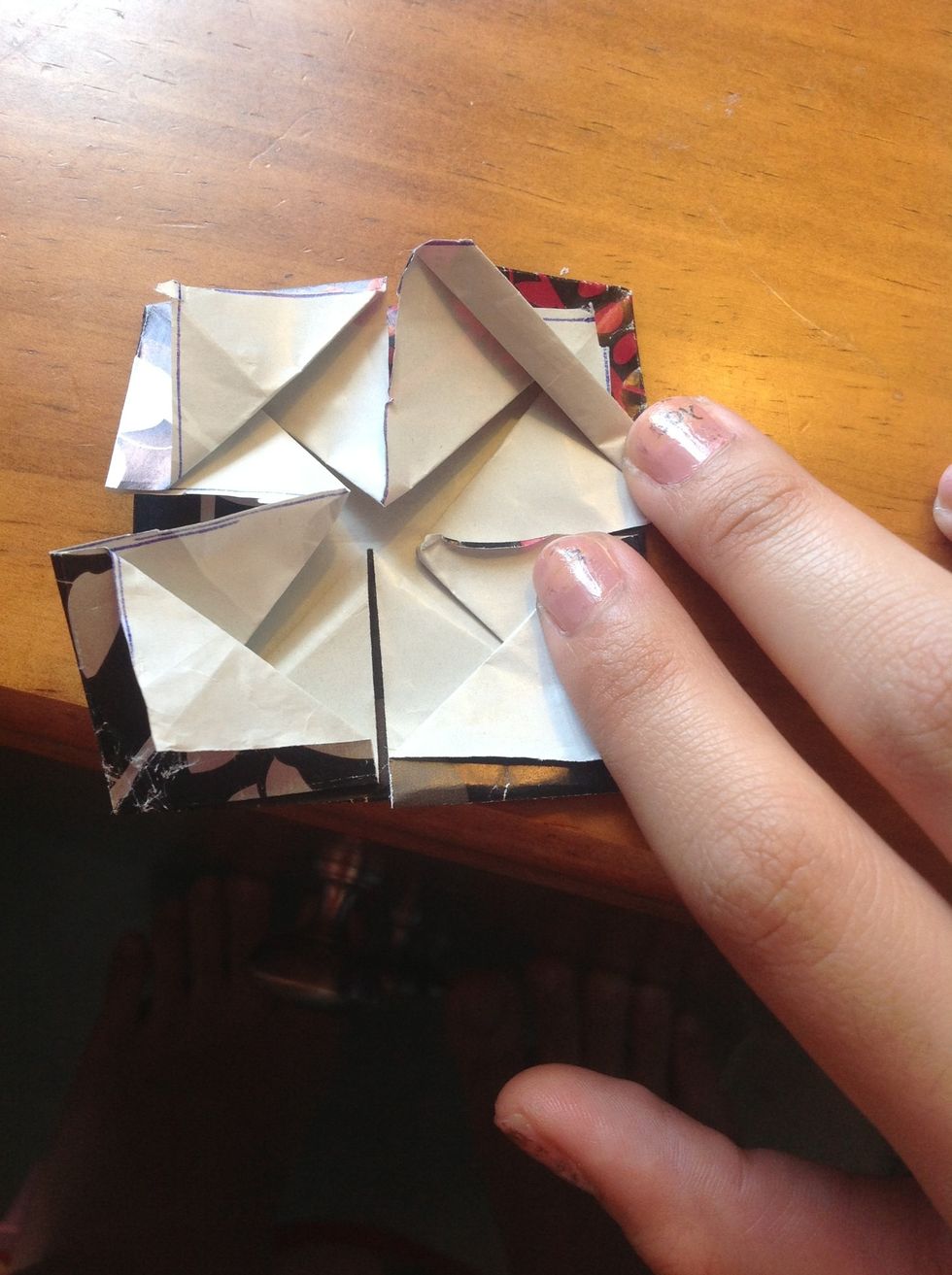 Fold the bottom up like the photo. (This is why you don't fold the flap completely)