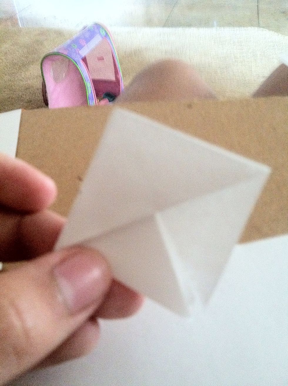 Fold the bottom up to show two triangles
