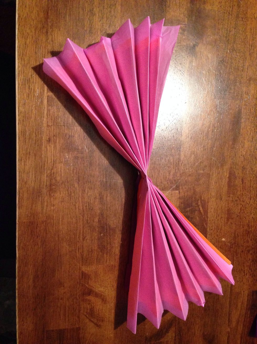 Fold the combined sheets of tissue paper accordion style.