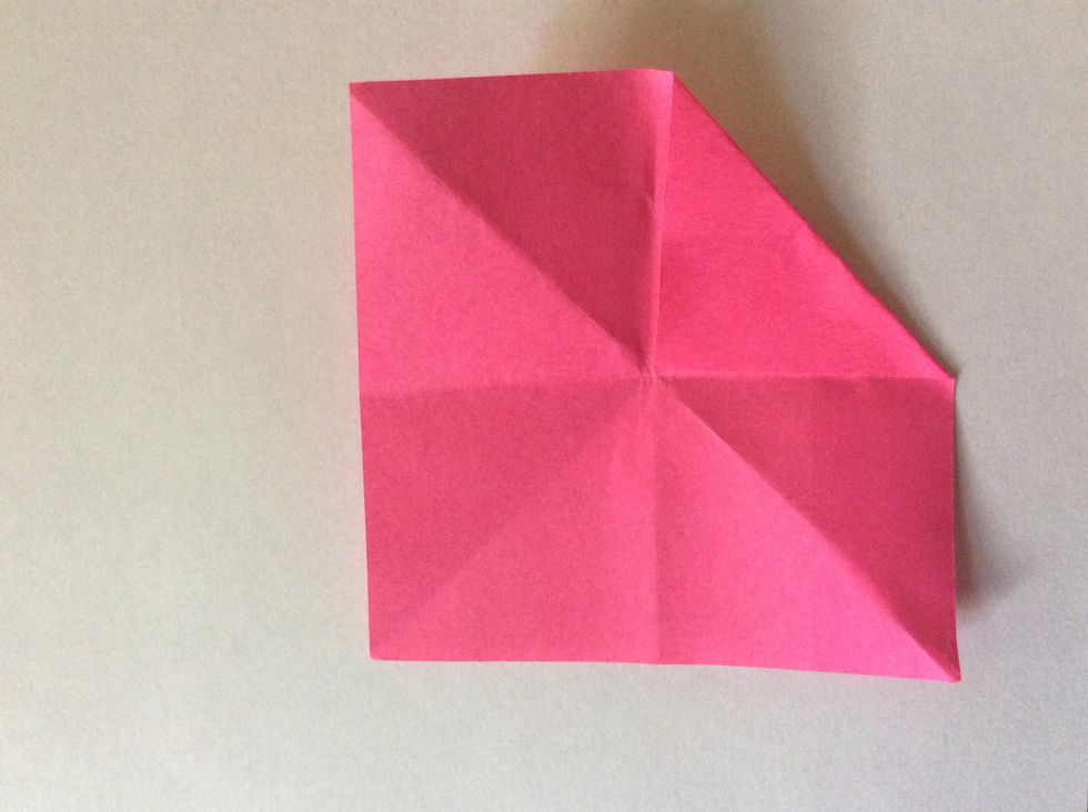 Fold the corner of the sticky side to the middle