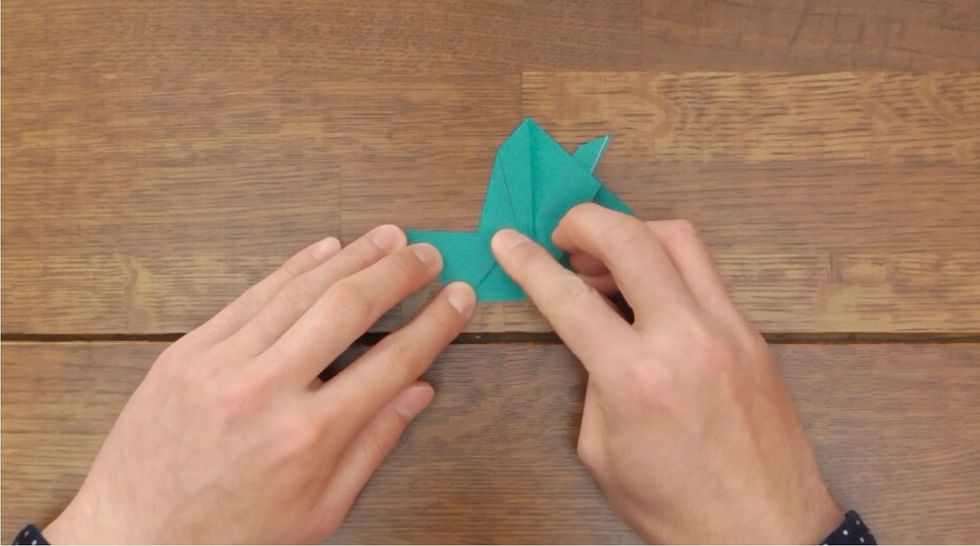 Fold the corner to the left.