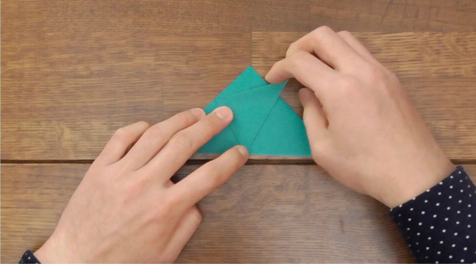 Fold the corner up at about 60 degrees.