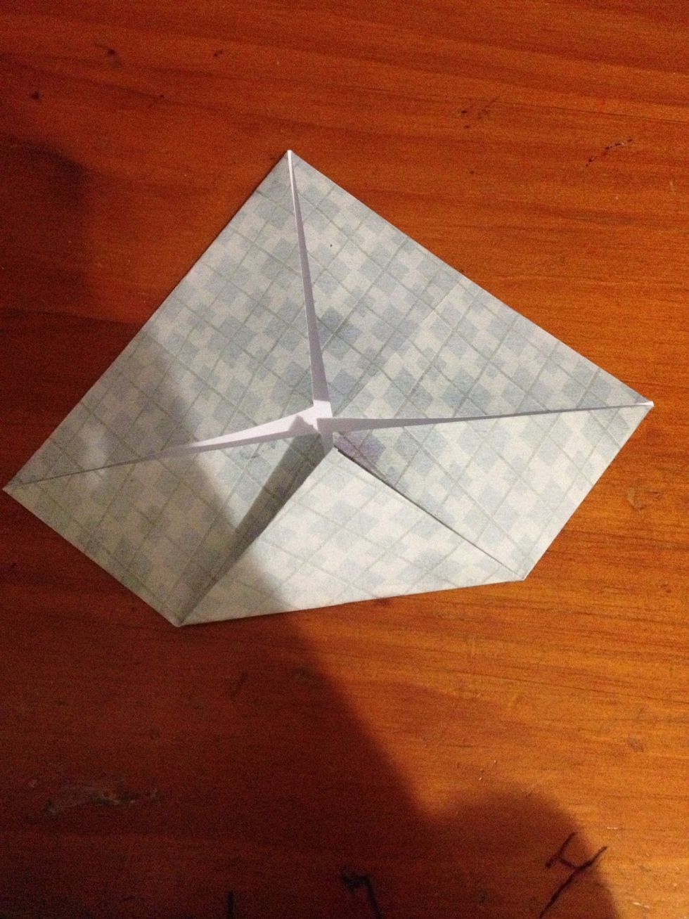Fold the corners into the centre again