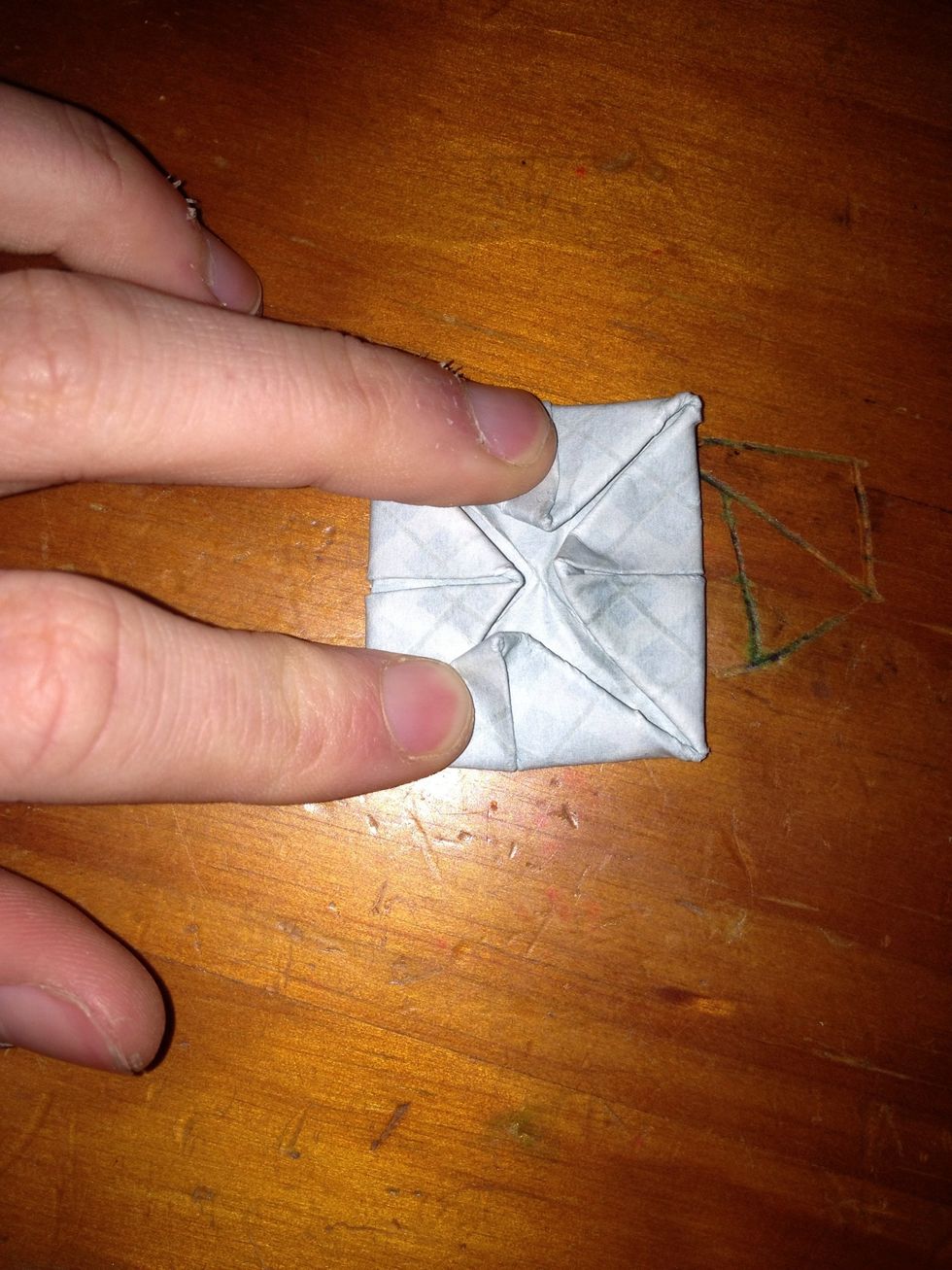 Fold the corners into the centre on this side