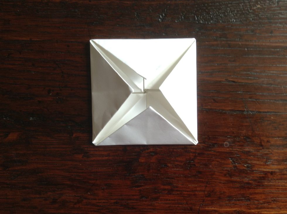 Fold the corners into the middle one more time.