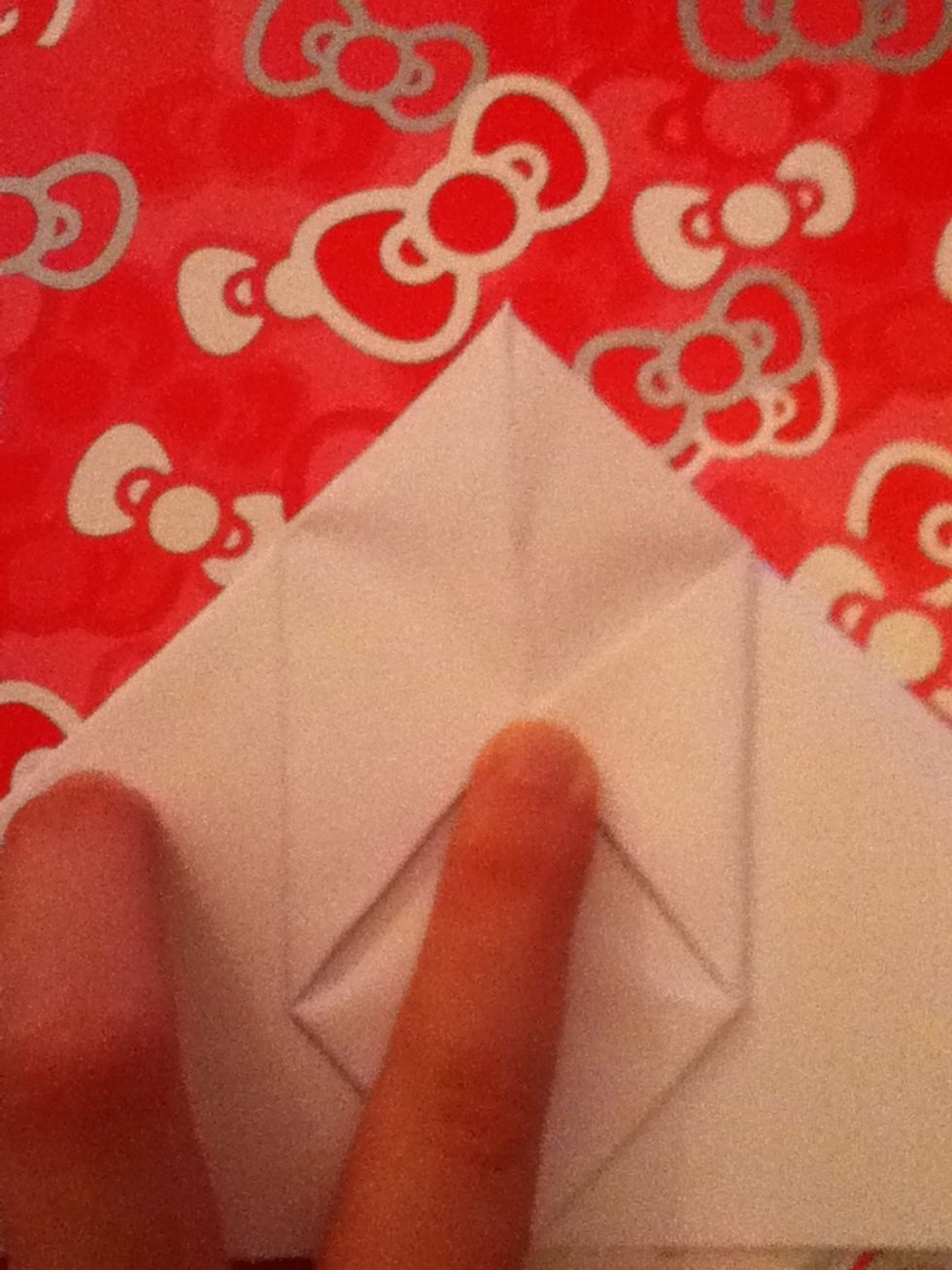 Fold the corners of the middle diamond to the centre line