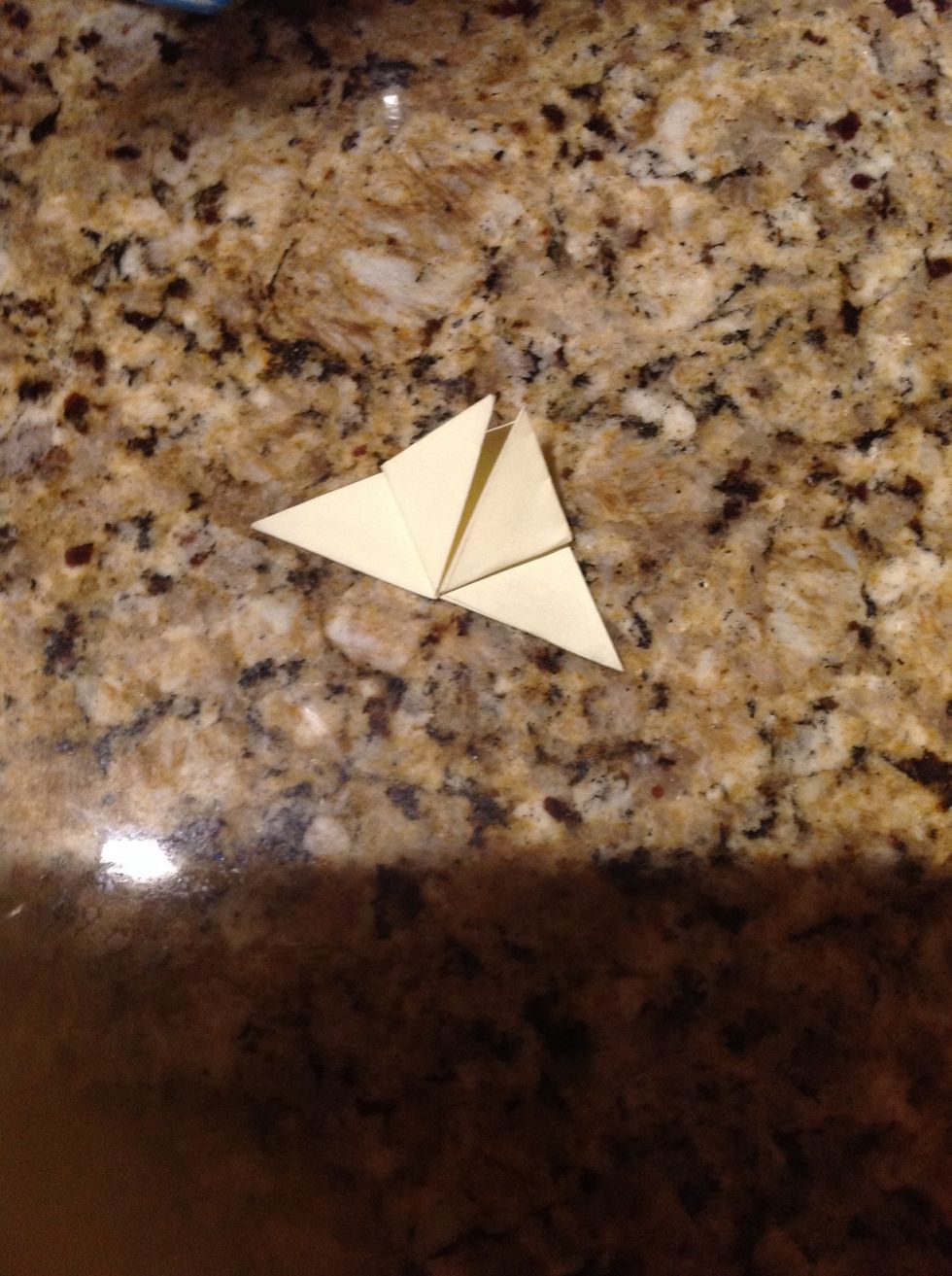 Fold the corners on the top layer up to the center corner.