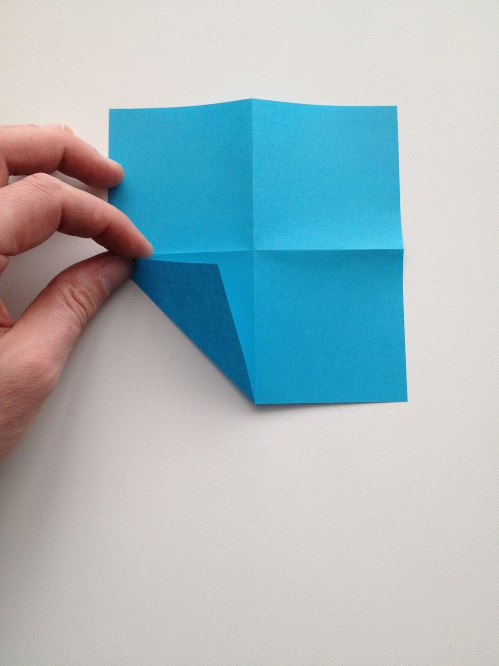 Fold the corners to the center.