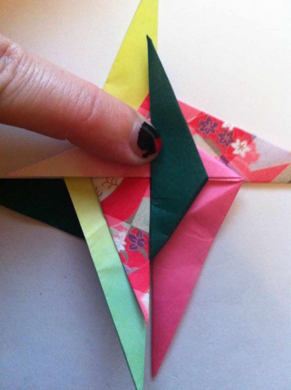Fold the dark one up like so.