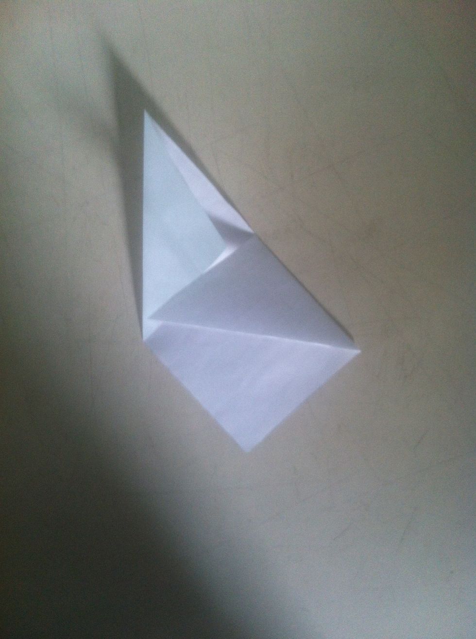 Fold the diagonal towards the left or right ( where your other square is )