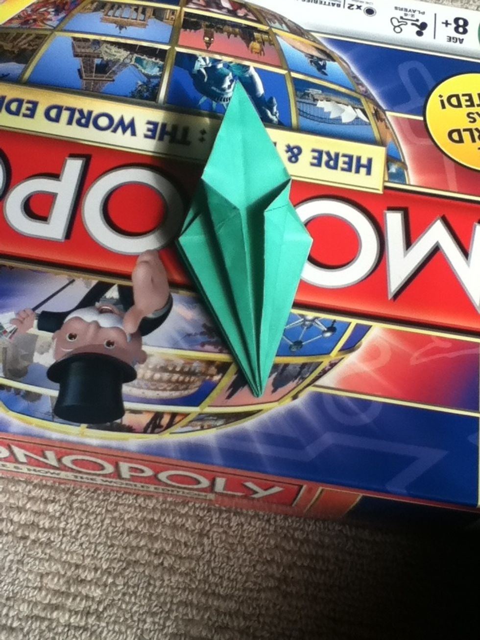 Fold the edges if the top layer into the middle