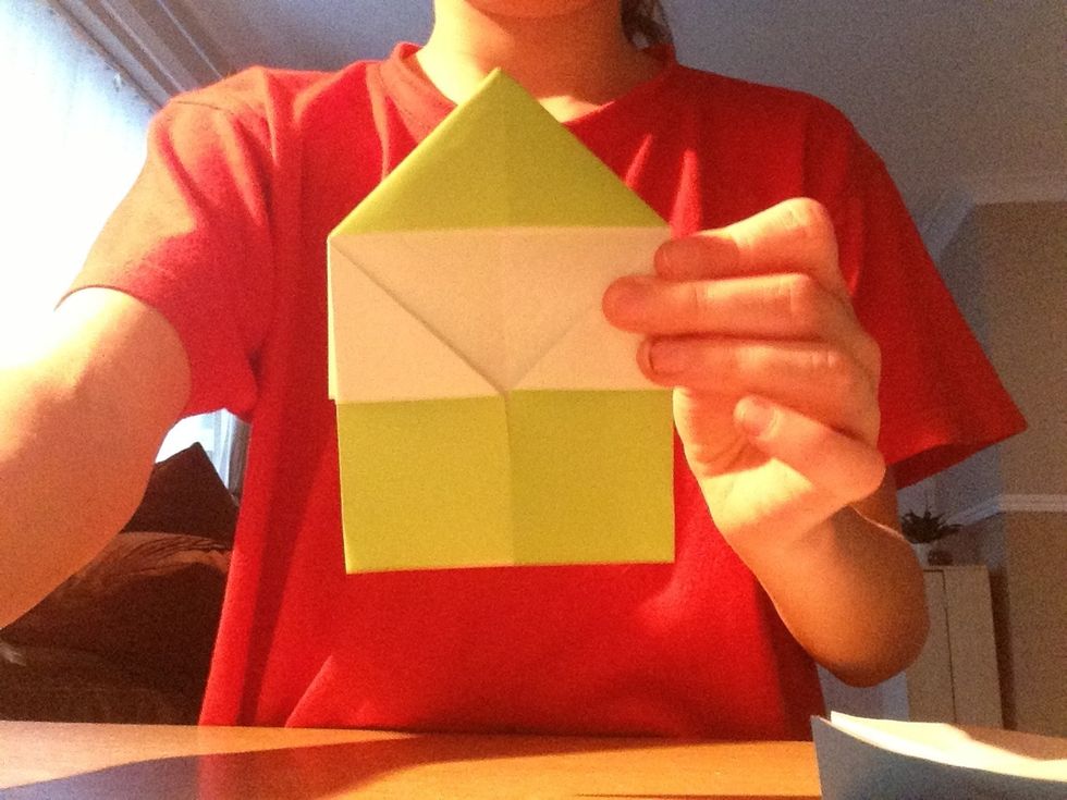 Fold the edges into the middle forming a house like shape