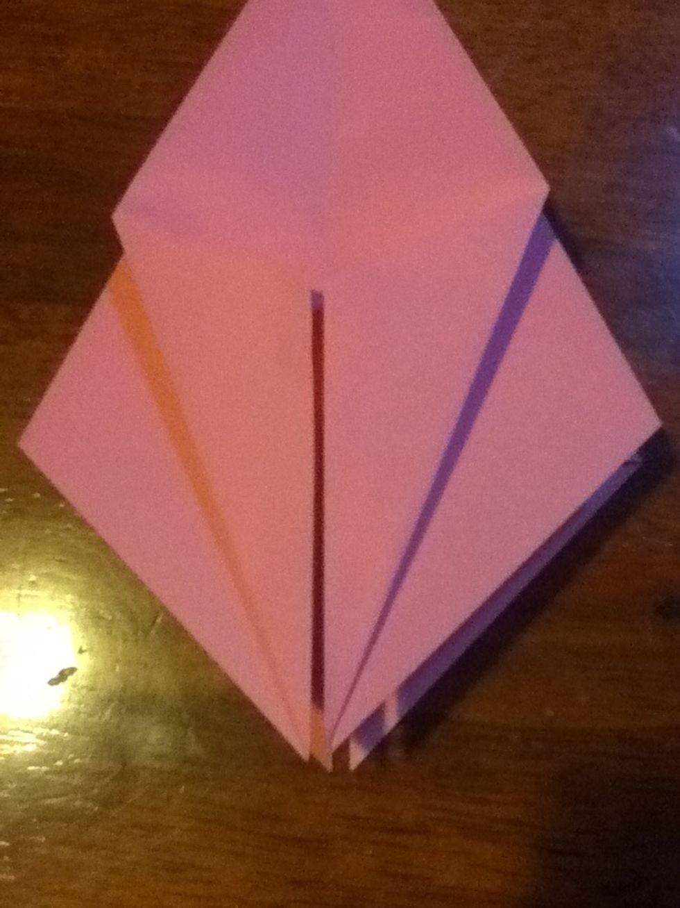 Fold the edges up to meet with the centre