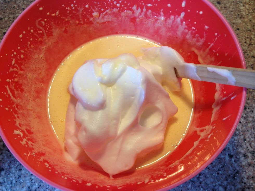 Fold the egg whites into the egg yolk lemon mix.