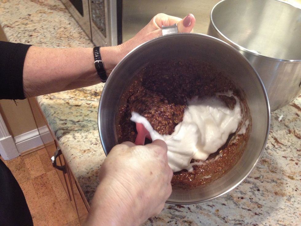 Fold the egg whites into the nut mixture.