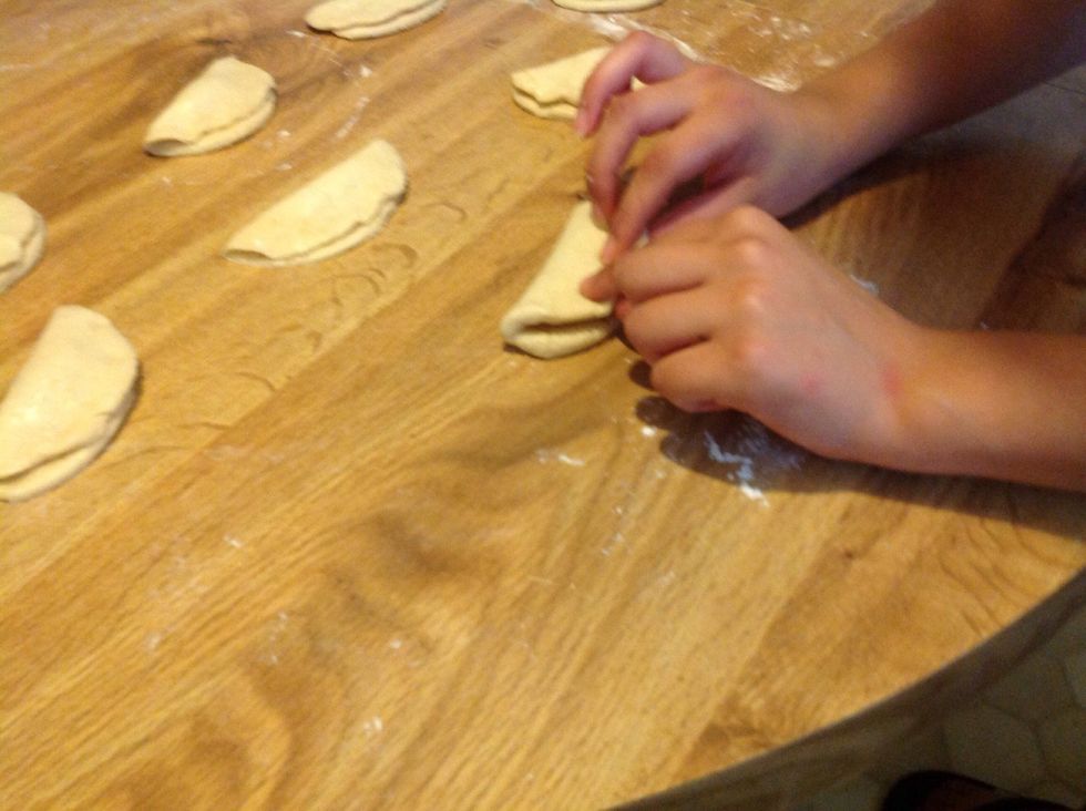 Fold the empanada and with a fork make a little decoration around