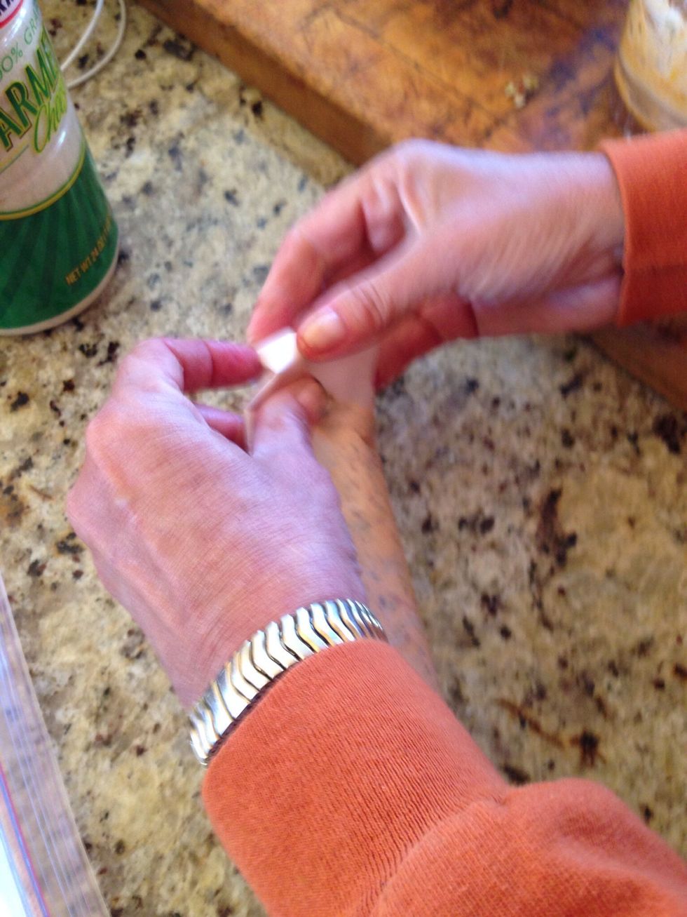 Fold the ends under and crease until tight against butter