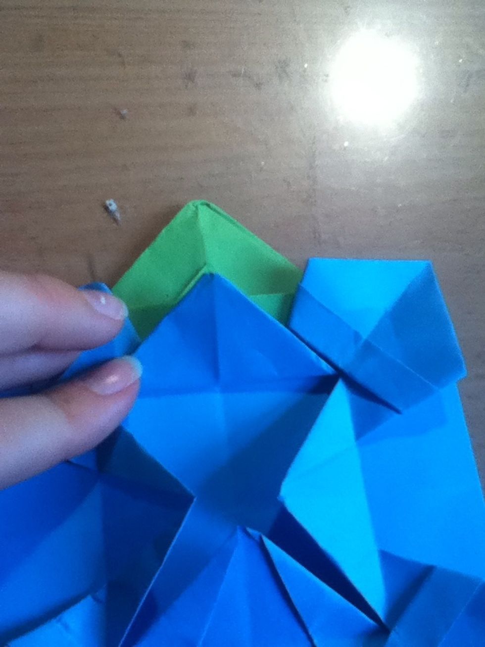 Fold the entire middle triangle up (along with the bottom layer)