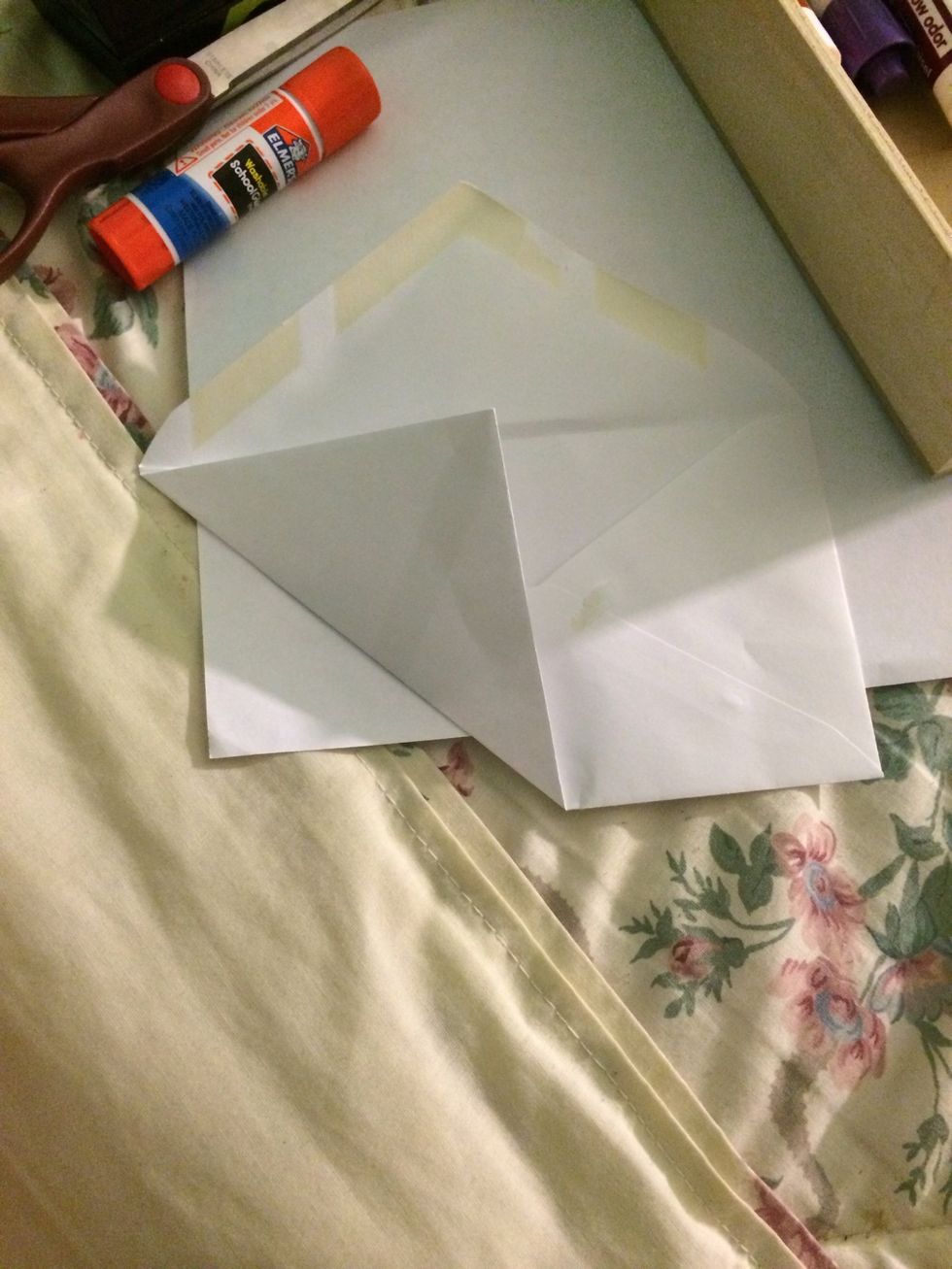 Fold the envelope in the corner all the way to the top line.