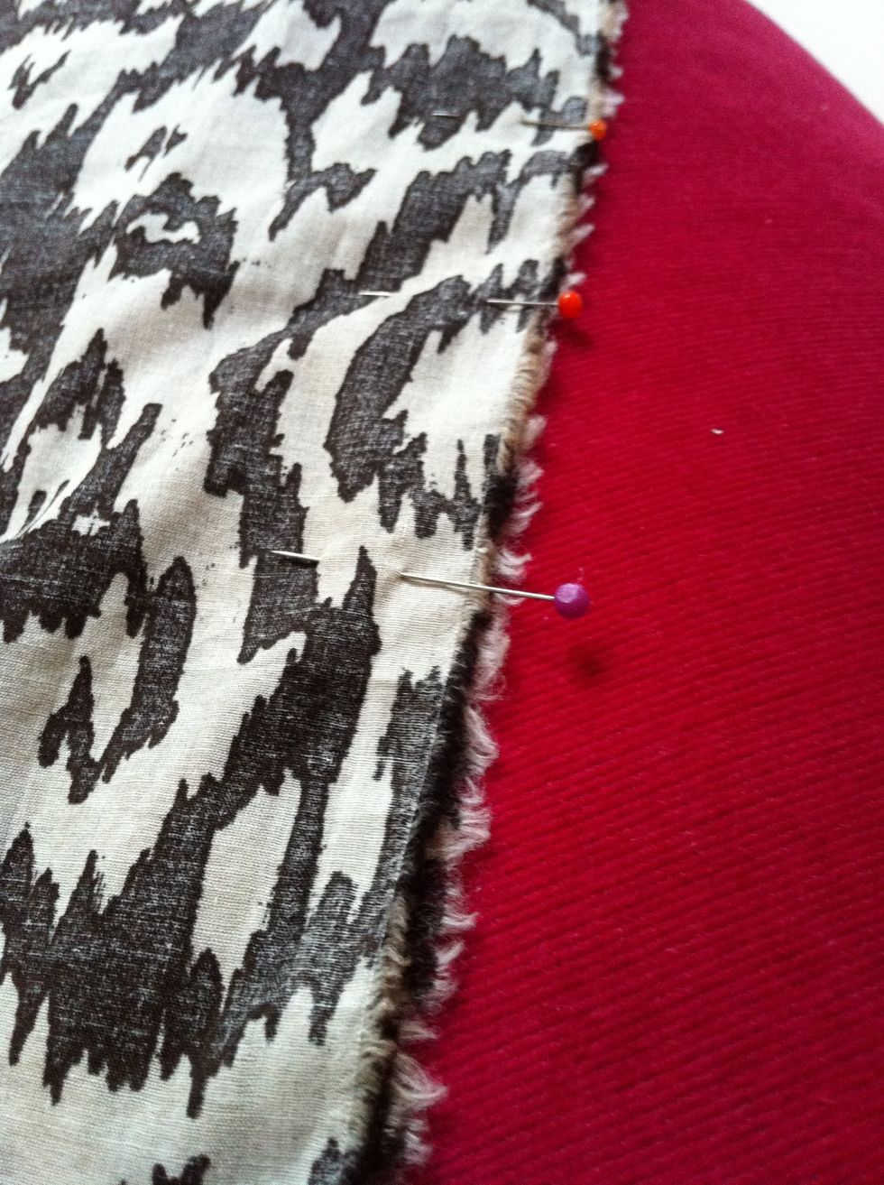 Fold the fabric along the longer edge. It's important to have the adverse side up and the right side folded in!! Insert pins to hold it in place.