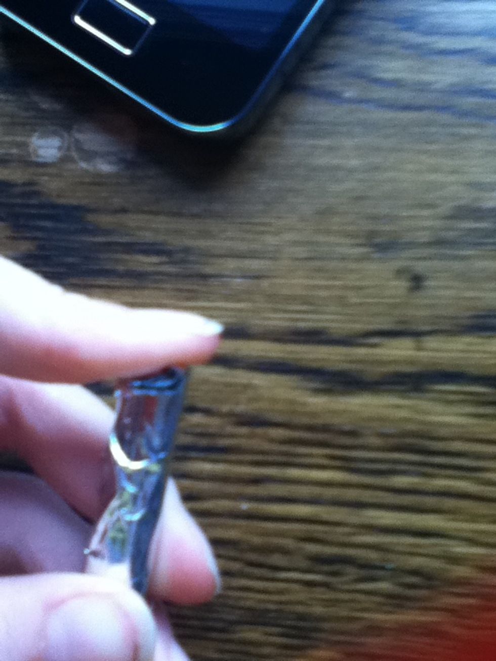 Fold the finger width edges over the pencil and seal with tape on both sides