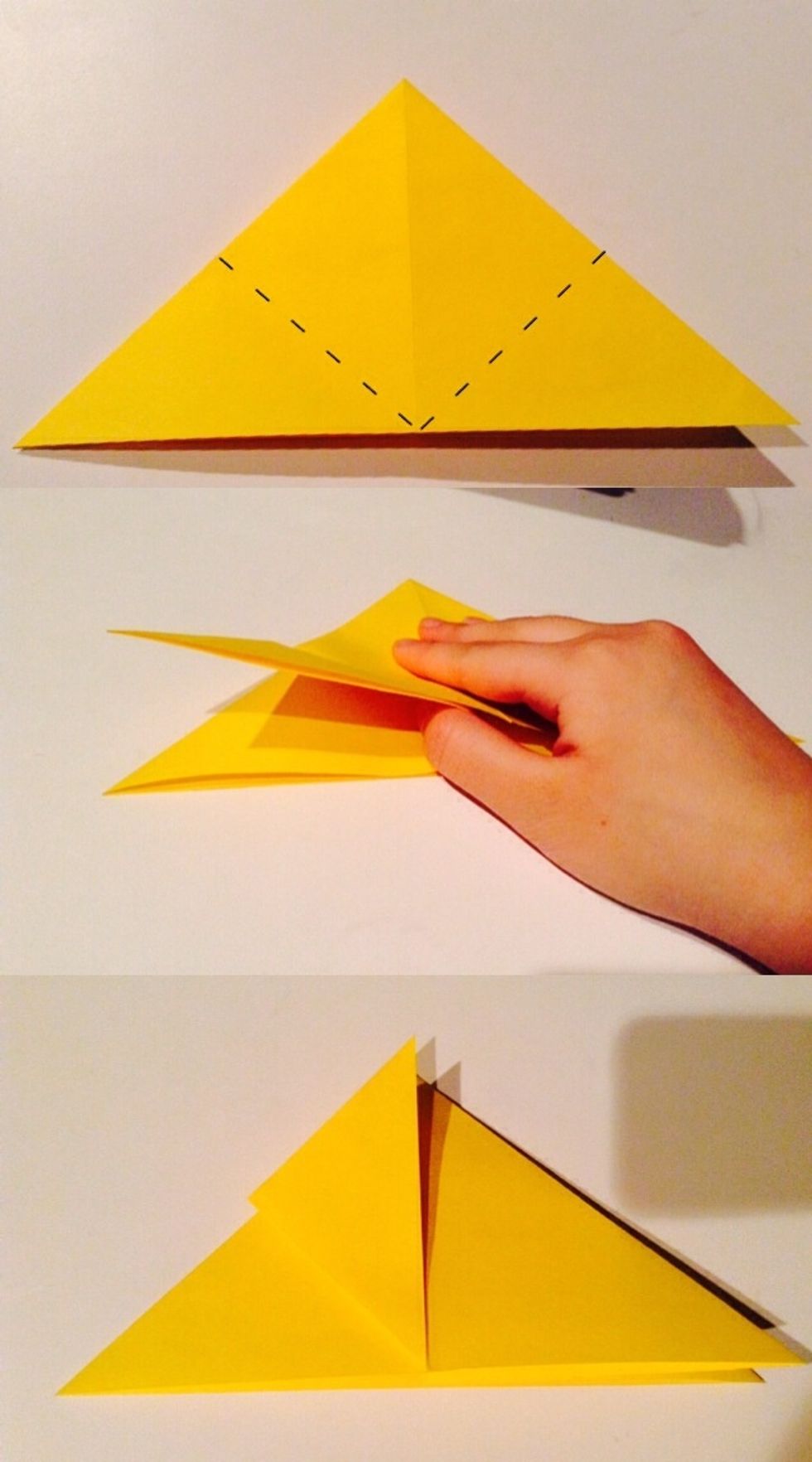 Fold the first flap, at the left, to the very tip of the triangle. Now do the same to the right flap.