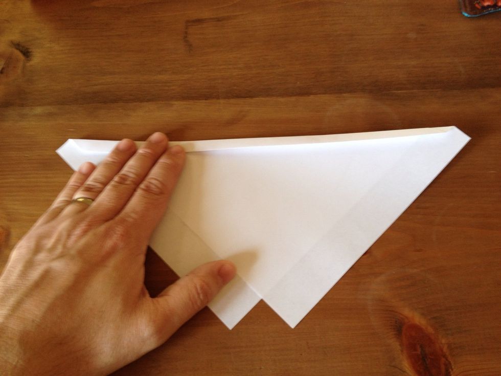 Fold the folded edge of the paper over again about 3/8".