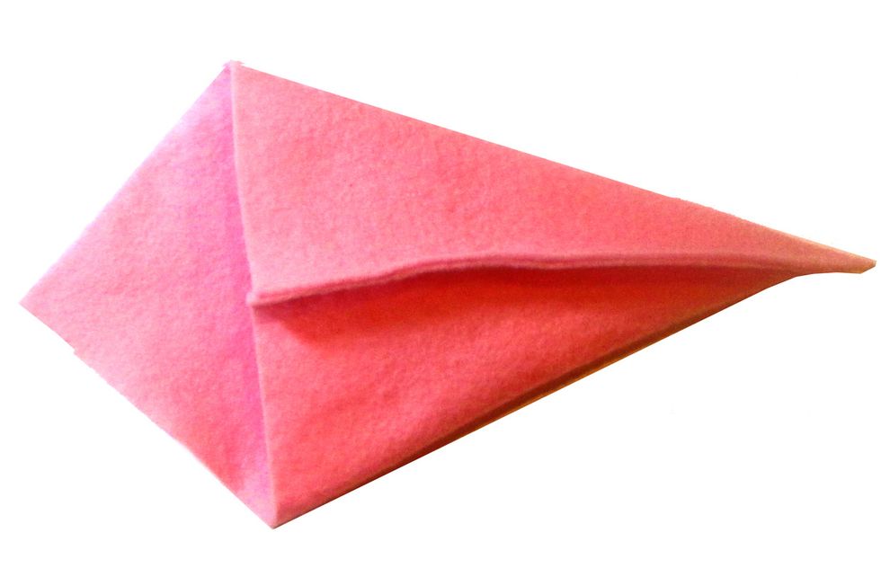 Fold the glued edge over as shown, to form an "ice cream cone" shape.