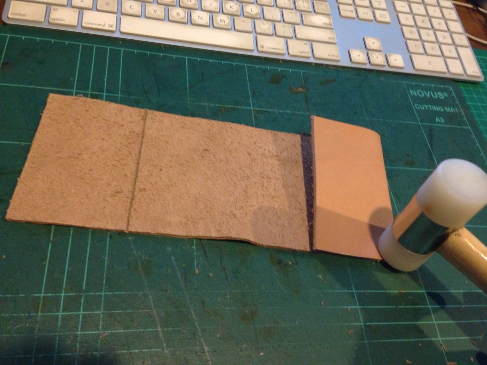 Fold the inner layer and hit it gently with the mallet