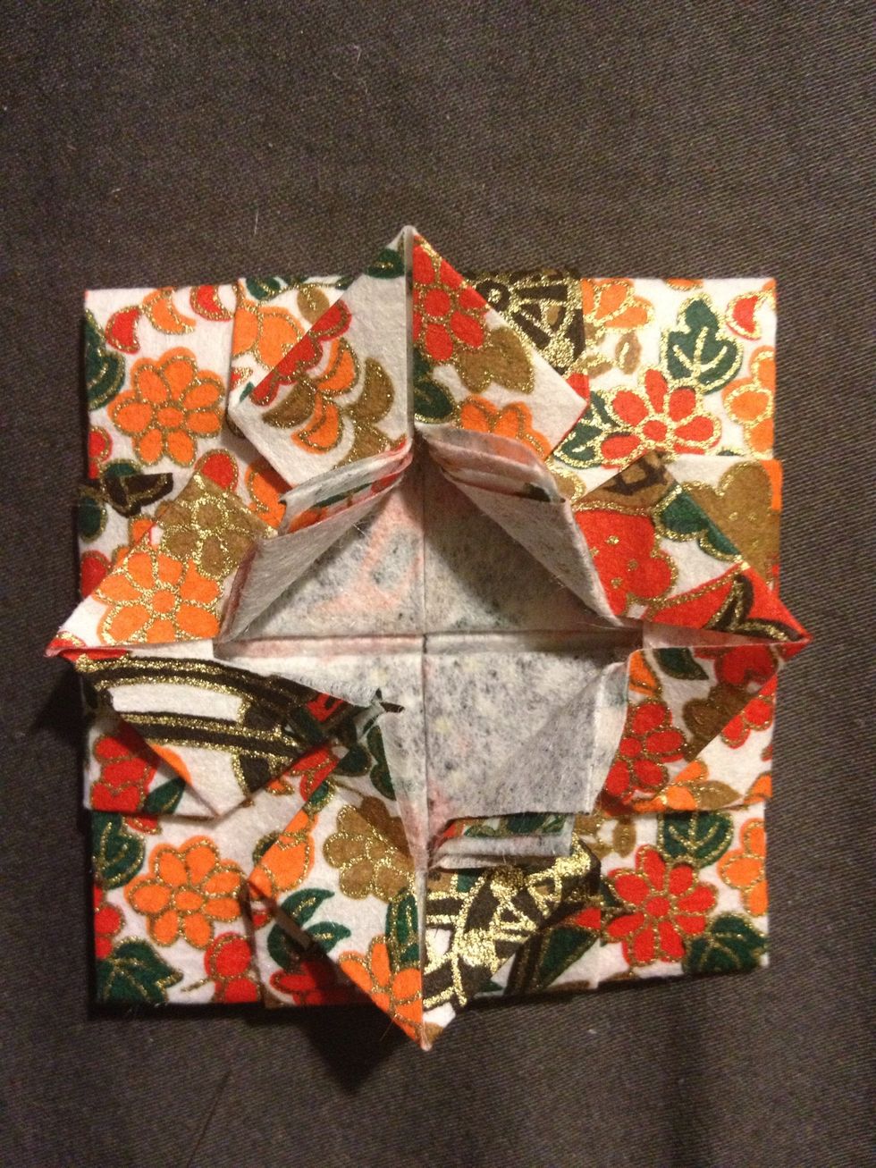 Fold the inside corners out as shown
