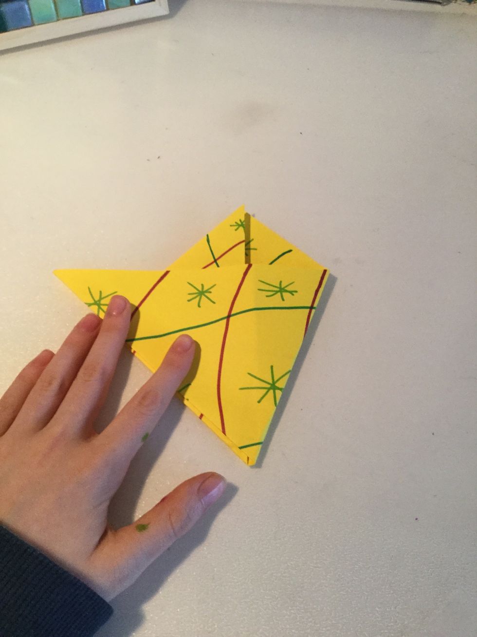Fold the inside edge to the outside edge and crease then put it back to how it was before. Do the same on the other side.