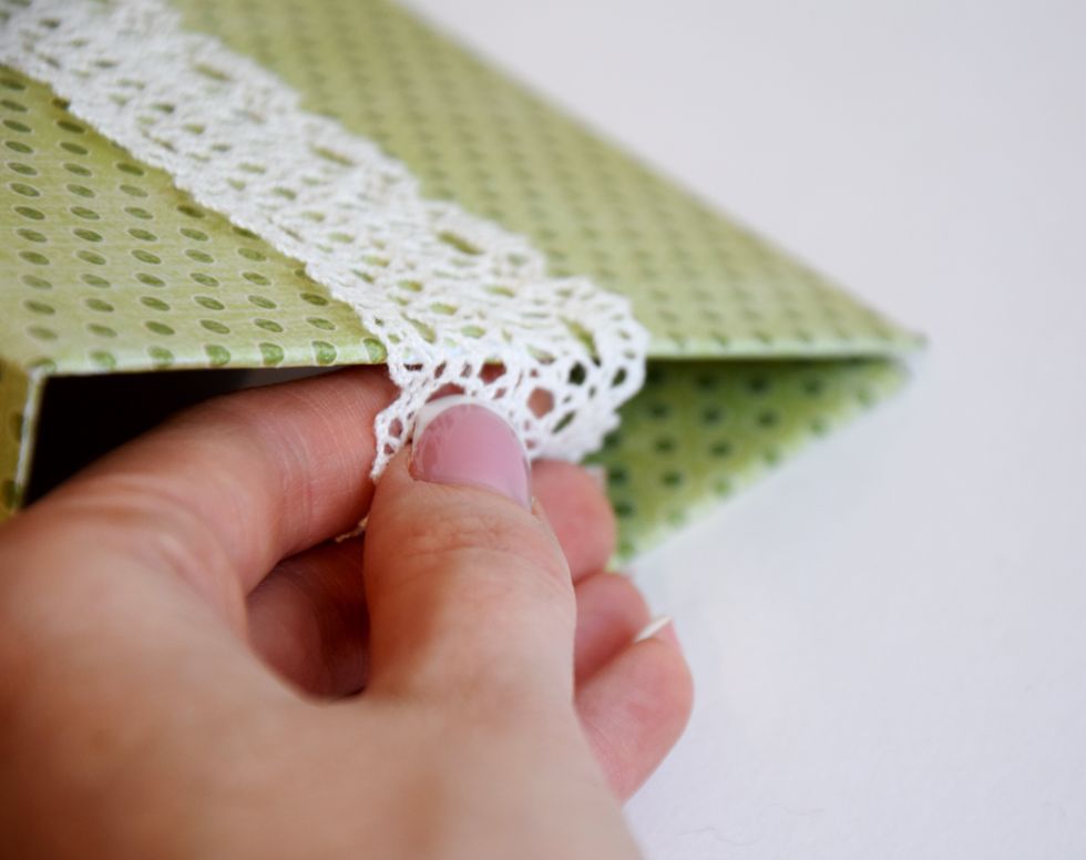 Fold the lace to the inside of the cover