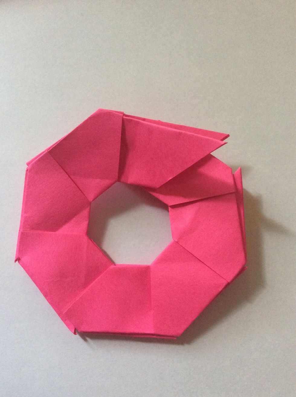 Fold the last piece into the tails of the other piece