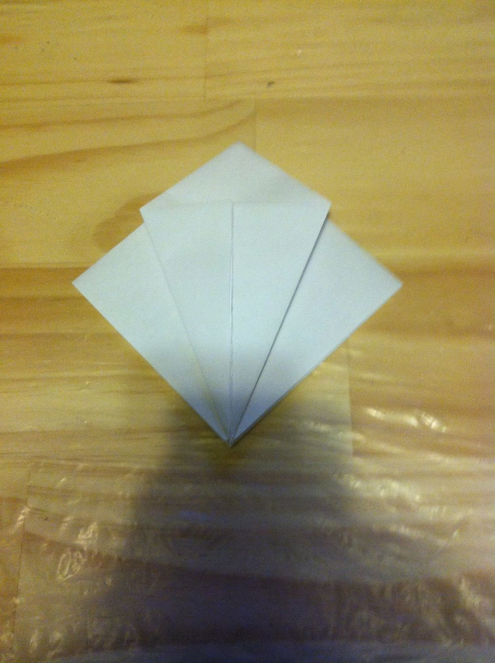 Fold the left and right corners to the center (top layer only!)