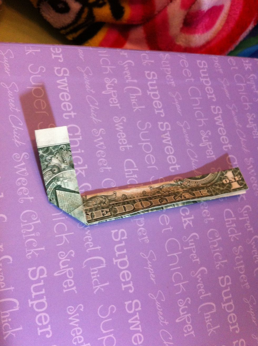 Fold the left side up so it's covering half of the "n"