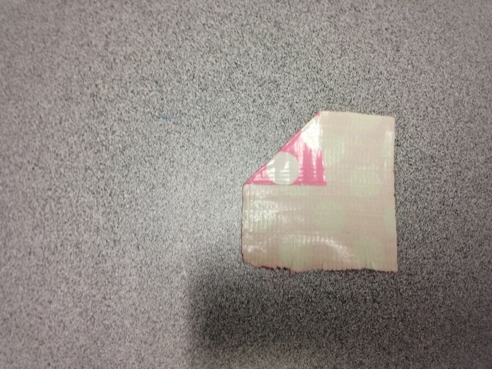 Fold the left upper hand corner towards the middle.