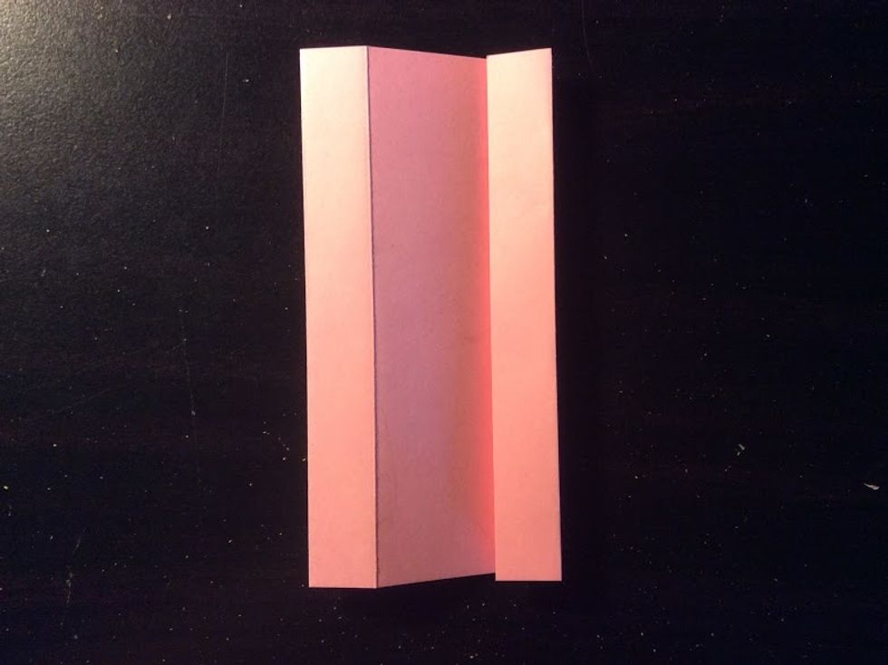 Fold the little edge on the right side to the third crease.